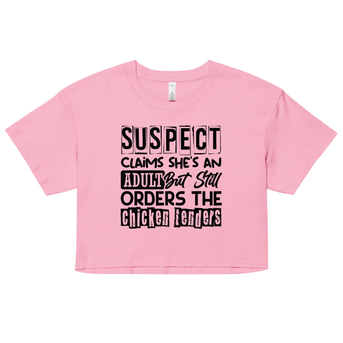 crop top with black text “Suspect Claims She’s an Adult But Still Orders the Chicken Tenders